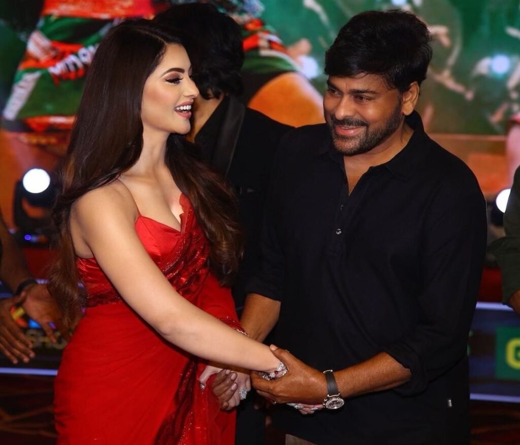 Urvashi Rautela touches megastar Chiranjeevi’s feet at Waltair Veerayya success event netizens impressed